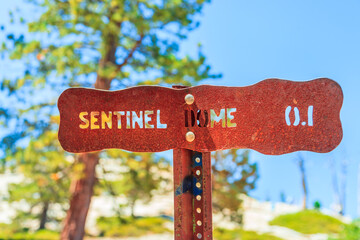 Yosemite National Park road sign at Sentinel Dome summit for hikers enjoying view of popular El...