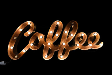 Rusty metal signboard of Coffee isolated on black background