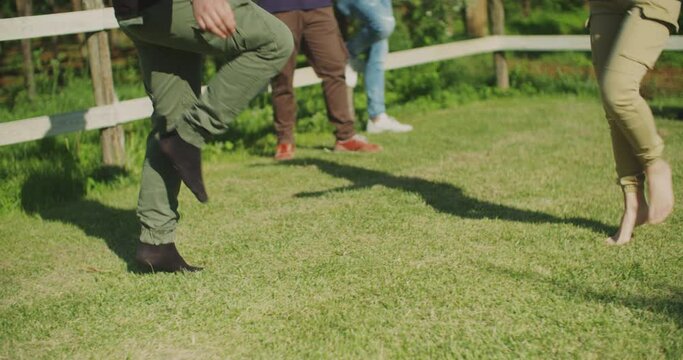 group of friends play music and dancing outdoors. shot in slow motion