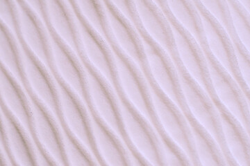 Soft blurred pale pink rib waves fabric texture background.