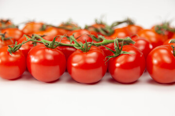 Cherry tomatoes over white background