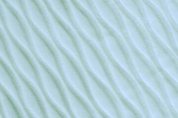 Soft blurred pale blue rib waves fabric texture background.