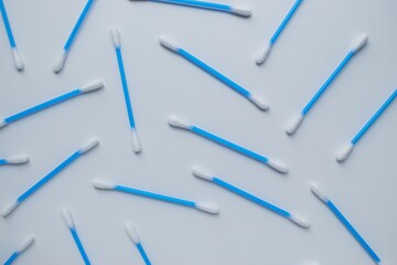 Ear sticks with blue plastic on a white background. Personal hygiene and self-care. Cosmetology and medicine.