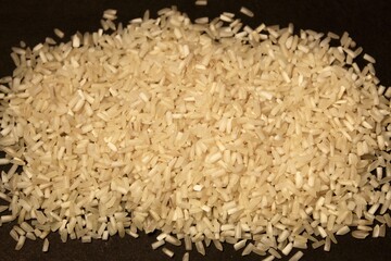 close up of white rice with dark background