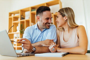 Loving couple at home office, portrait.