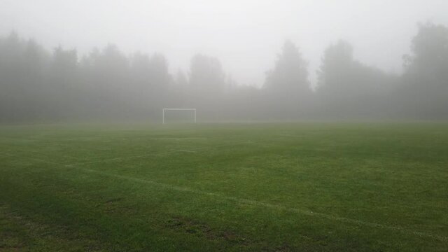 empty sports field in fog