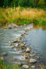 Boulders forms a miniature waterfall on Tongariro River