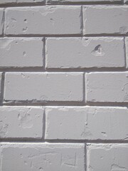 Close-up of a white masonry brick wall.