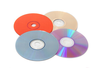 Several multi-colored CDs on a white background - 368436709