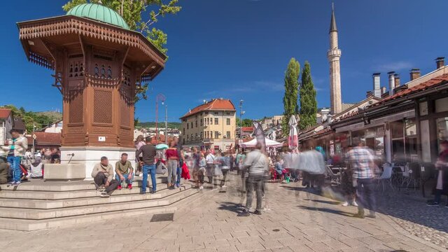 The Sebilj fountain in Sarajevo old city in Bosnia and Herzegovina timelapse hyperlapse. The Sebilj fountain is an Ottoman style wooden fountain in the centre square in Sarajevo