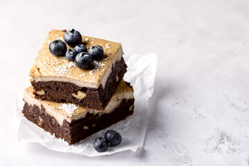 Pieces of Homemade Chocolate Brownies Decorated with Ripe Blueberry on Gray Background Tasty Chocolate Dessert Horizontal