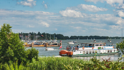 Boats at harbor at Mikolajki, Poland. Mikolajki is a resort town in the Warmian-Masurian...