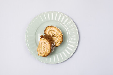 Chocolate Cake Roll Pieces of Chocolate Dessert on Plate Top View Copy Space