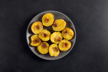 Baked potatoes with lard, a strata-fast delicious lunch, in a plate on a stone table. Copy space.