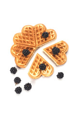 Belgium waffles with fresh berries isolated on white background