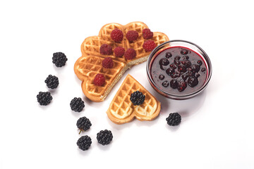 Belgium waffles with fresh berries and jam isolated on white background
