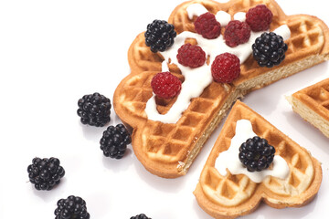 Belgium waffles with fresh berries isolated on white background