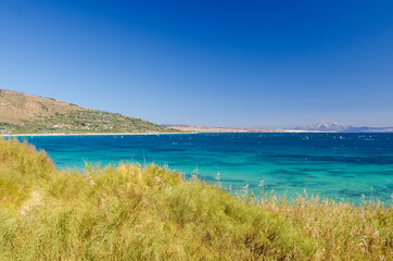Beautiful seascape with blue sky and Atlantic ocean. Morocco and mount Jebel Musa on the background. Punta Paloma beach, Tarifa, Provence of Cadiz, Spain. 