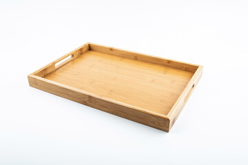 Empty plate on a bamboo tray on white background
