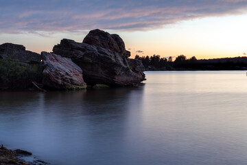 Rocks at Keyhole Reservoir in Wyoming at sunset. 