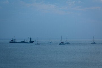 sunset with yachts on santorini island Greece