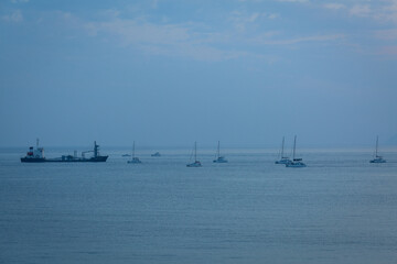 sunset with yachts on santorini island Greece