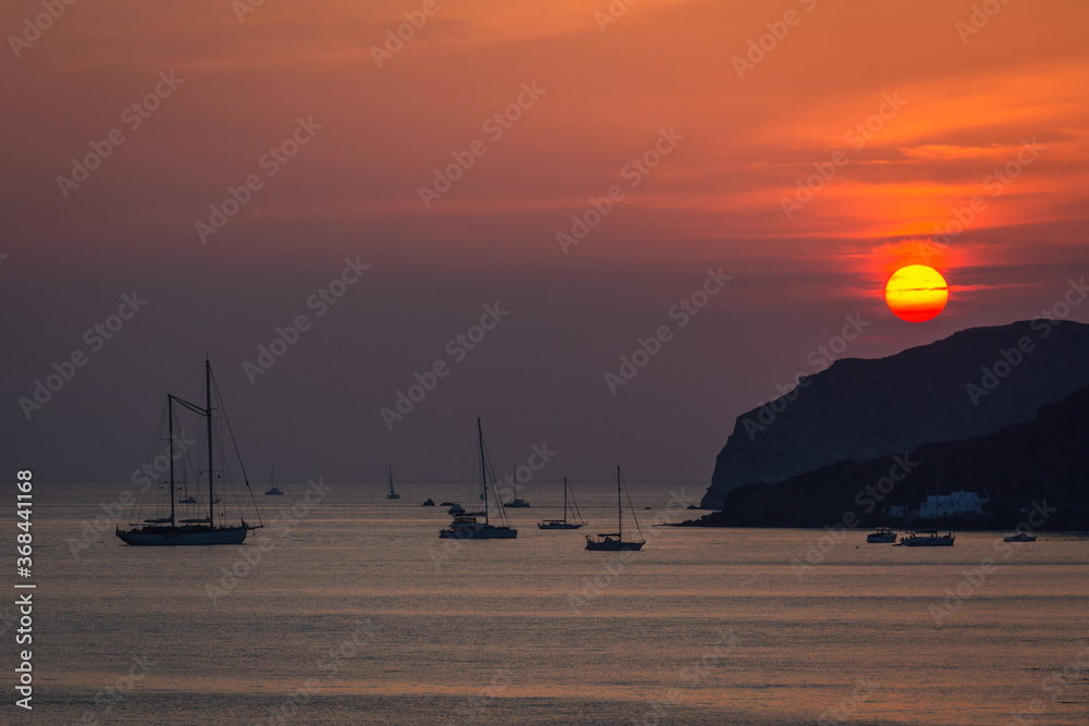 Wall mural sunset with yahts on Santorini  island Greece