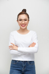 Confident woman with arms crossed - isolated over a white background