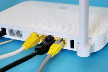 Fiber Optic Internet. Network cables 
Connected to a router, speed test concept. Wireless internet...