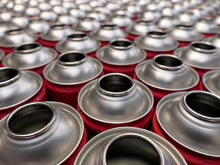 Empty aerosol cans in busy manufacturing business