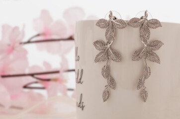 Close up of diamond earrings. space for your text.