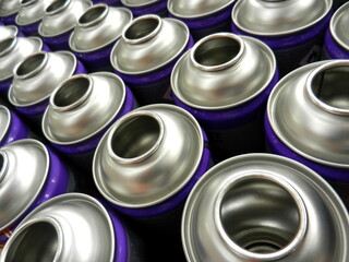 Empty aerosol cans in busy manufacturing business
