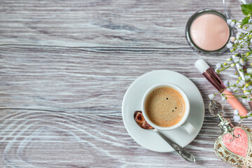 Decorative cosmetic make up tools and coffee cup. Breakfast and make up set. Concept of female mockup.