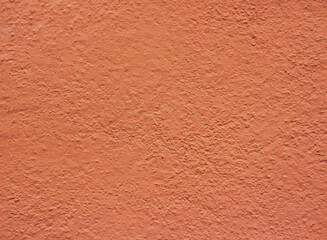 Orange concrete wall. Ginger background from grungy wall