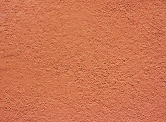 Fototapeta premium Orange concrete wall. Ginger background from grungy wall