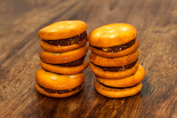 Homemade Pineapple Biscuits or Pineapple Cookies with jam on wooden table. Biscuits cookies for snack cracker.