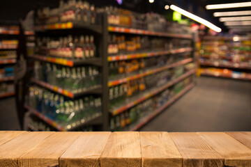 Wood top table on blur supermarket background
