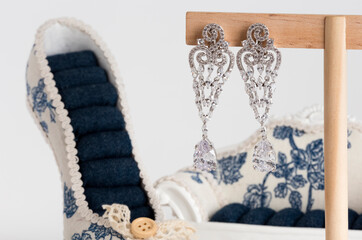 Close up of diamond earrings. space for your text.