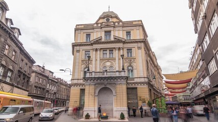 The Eternal flame in the street Ferhadija timelapse hyperlapse is a memorial to the military and civilian victims of the Second World War. Traffic on the road in Sarajevo