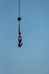 Fototapeta premium Industrial black lifting hook and cable wire hanging free