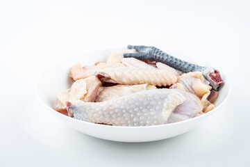 Fresh chicken nuggets on a dish on white background