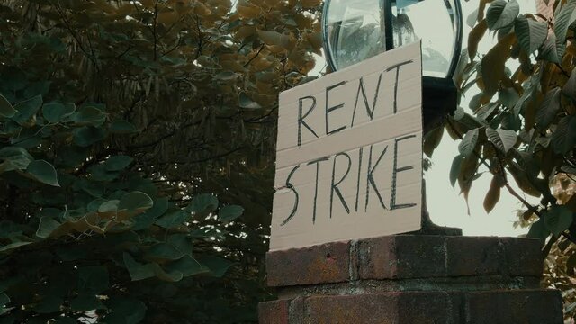rent strike sign outside