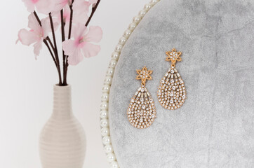 Close up of diamond earrings. space for your text.