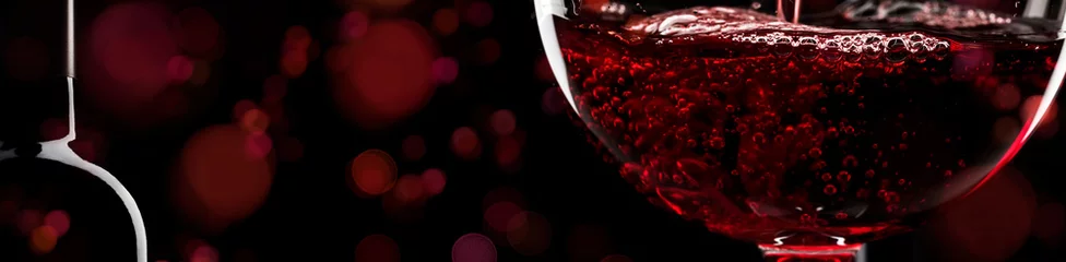 Rolgordijnen Red wine on black background, abstract splashing. Panoramic banner with copy space © 5ph