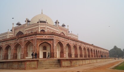 Humayun's Tomb,Delhi; A mousoleum made of red and white sandstone with arches,domes and canopies.