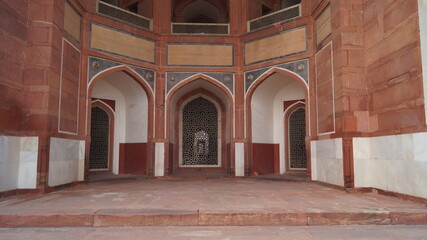 Inner part of Humayun's Tomb with arches,lattice work and balconies in red and white sandstone.