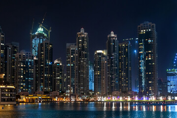 Fototapeta na wymiar Skyscrapers in the Downtown Dubai at night, UAE