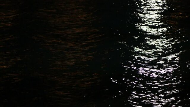 blinking lights over sea water surface at summer night
