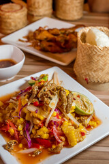 Corn Salad Fried fish (Som Tum) with Fried Chicken and Sticky rice.