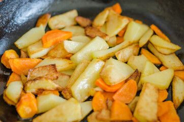 Delicious fried potatoes with carrots